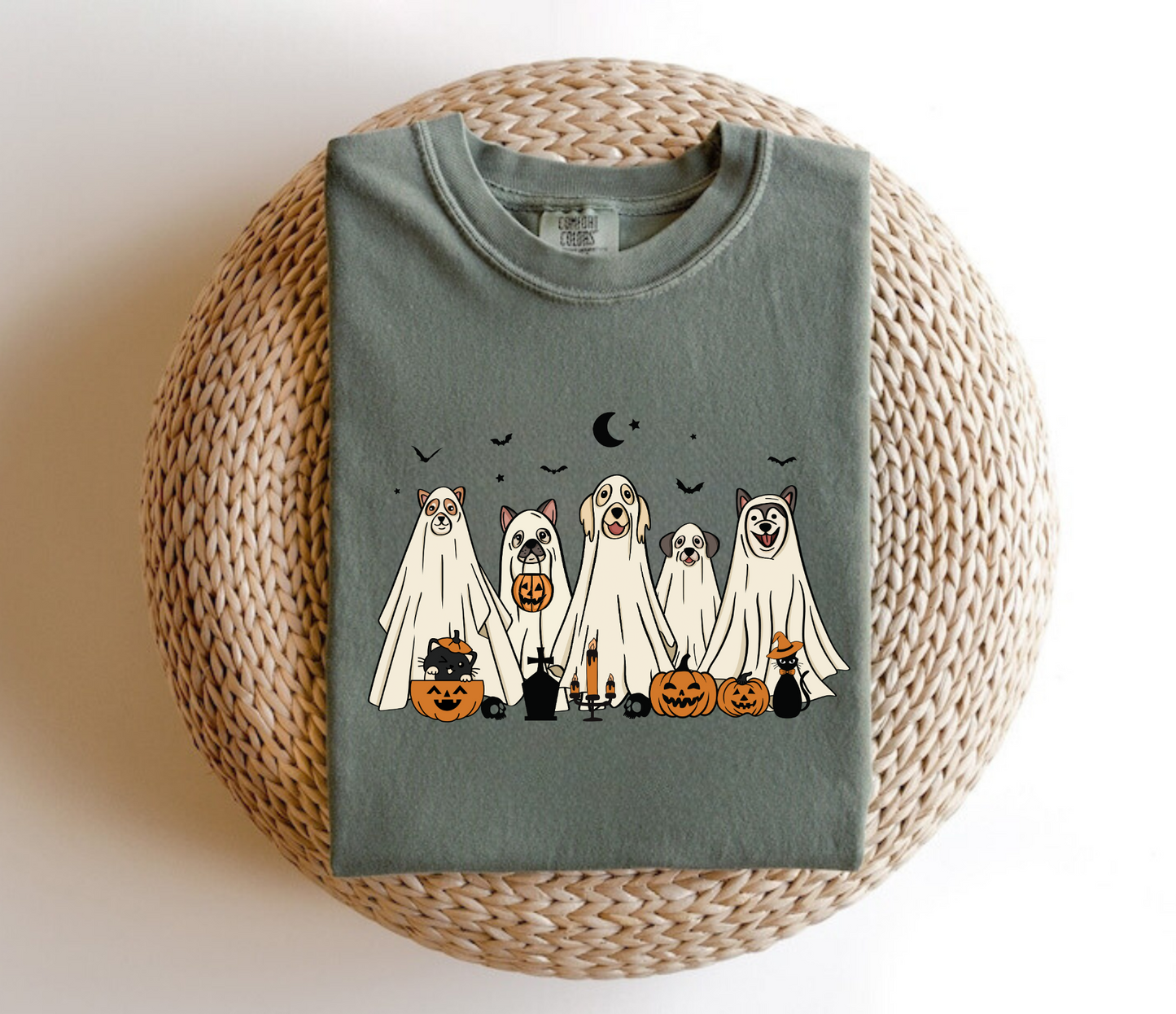 An oversized comfort colors shirt adorned with charming ghost dogs, capturing the essence of a cute and spooky Halloween. Ideal for dog lovers, this trendy shirt brings a touch of autumn to your wardrobe, making it a must-have for the fall season.