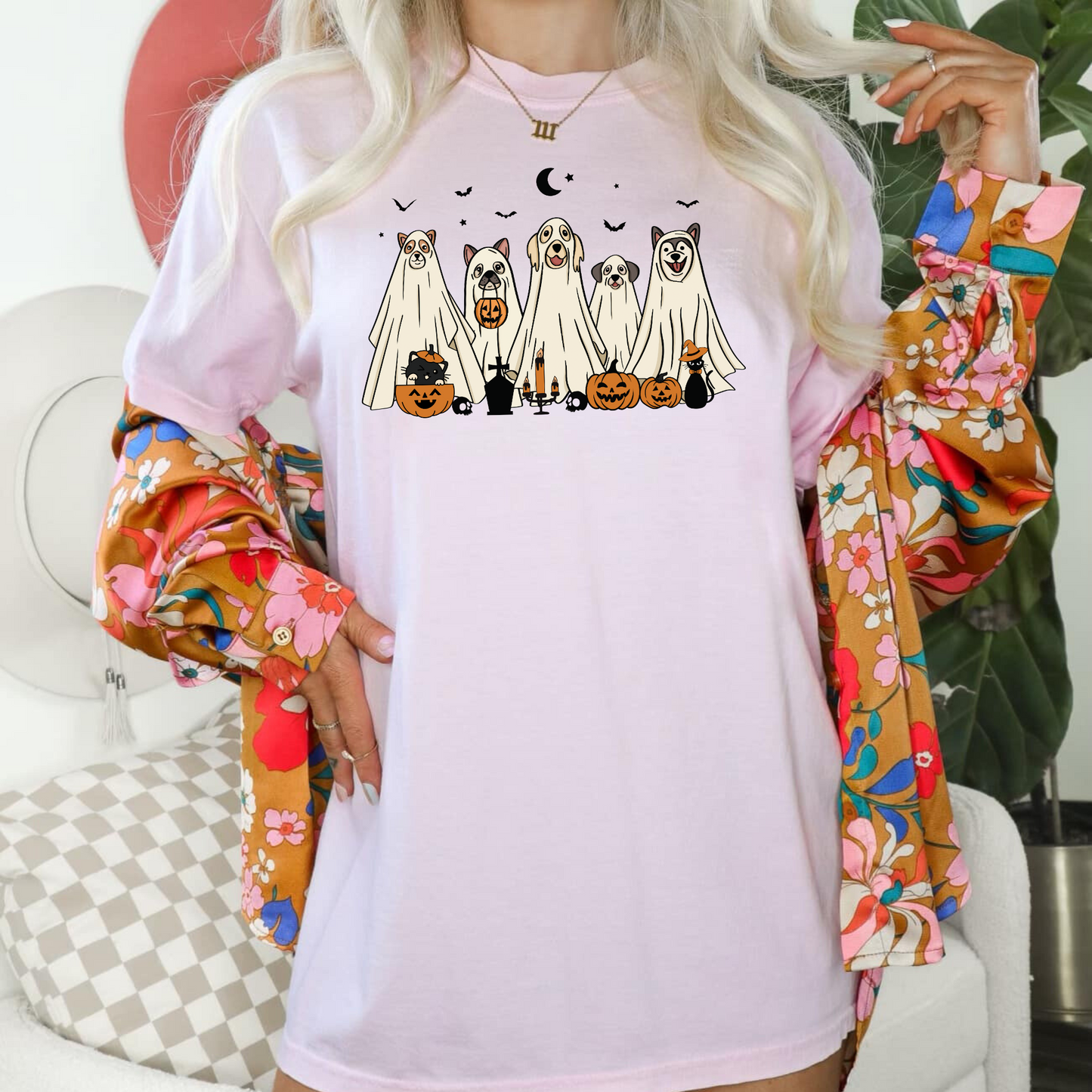 An oversized comfort colors shirt adorned with charming ghost dogs, capturing the essence of a cute and spooky Halloween. Ideal for dog lovers, this trendy shirt brings a touch of autumn to your wardrobe, making it a must-have for the fall season.