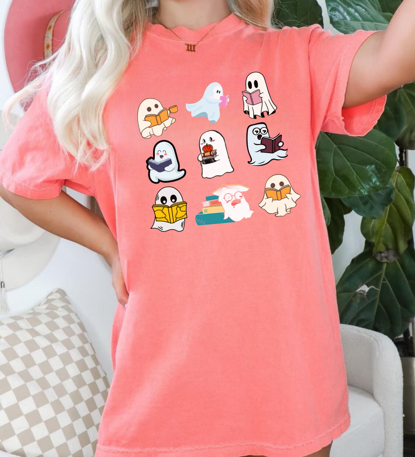 Teacher Halloween shirt featuring cute ghosts reading books, ideal for a funny and adorable teacher fall outfit. A playful design perfect for embracing the Halloween spirit.