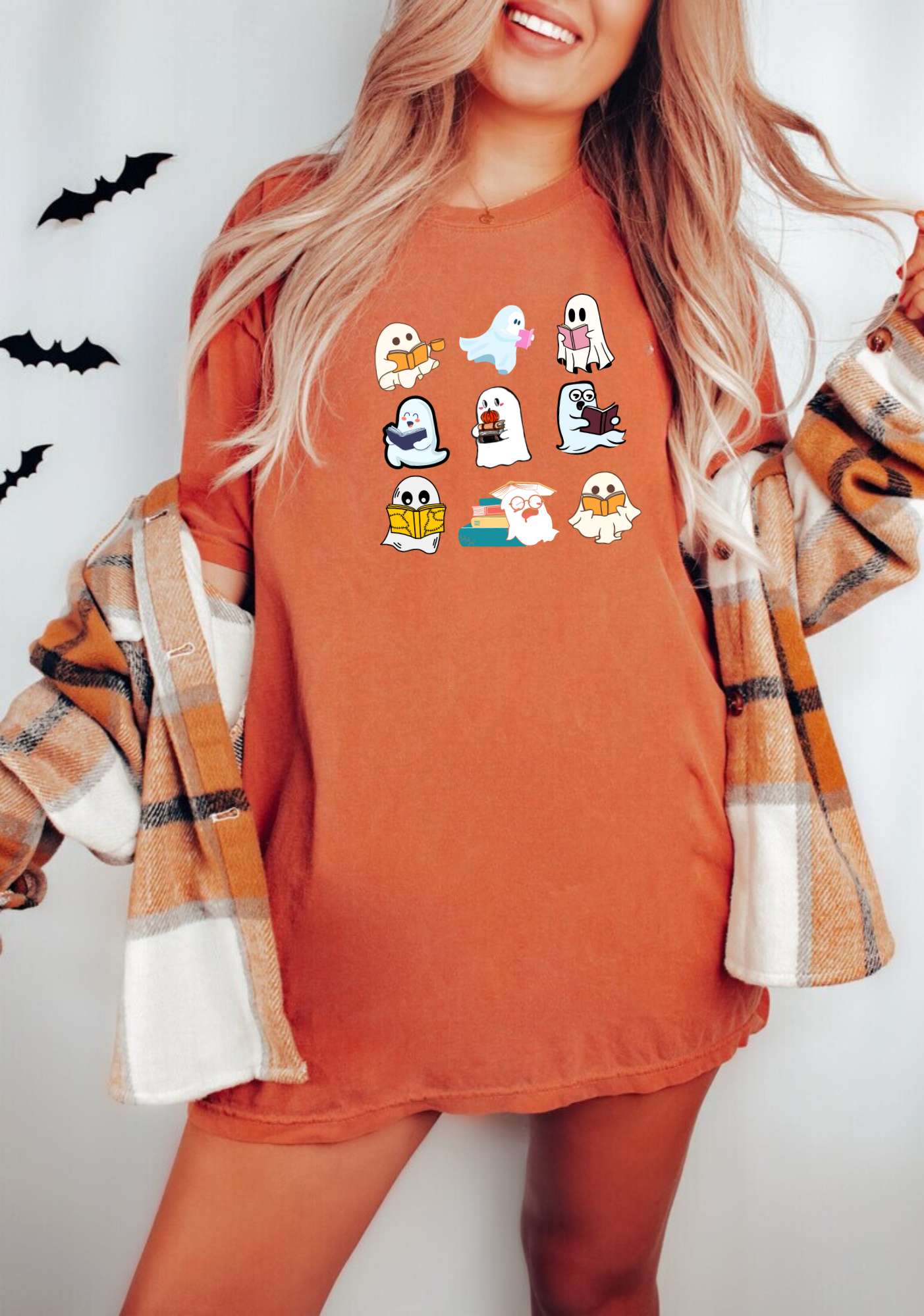 Teacher Halloween shirt featuring cute ghosts reading books, ideal for a funny and adorable teacher fall outfit. A playful design perfect for embracing the Halloween spirit.