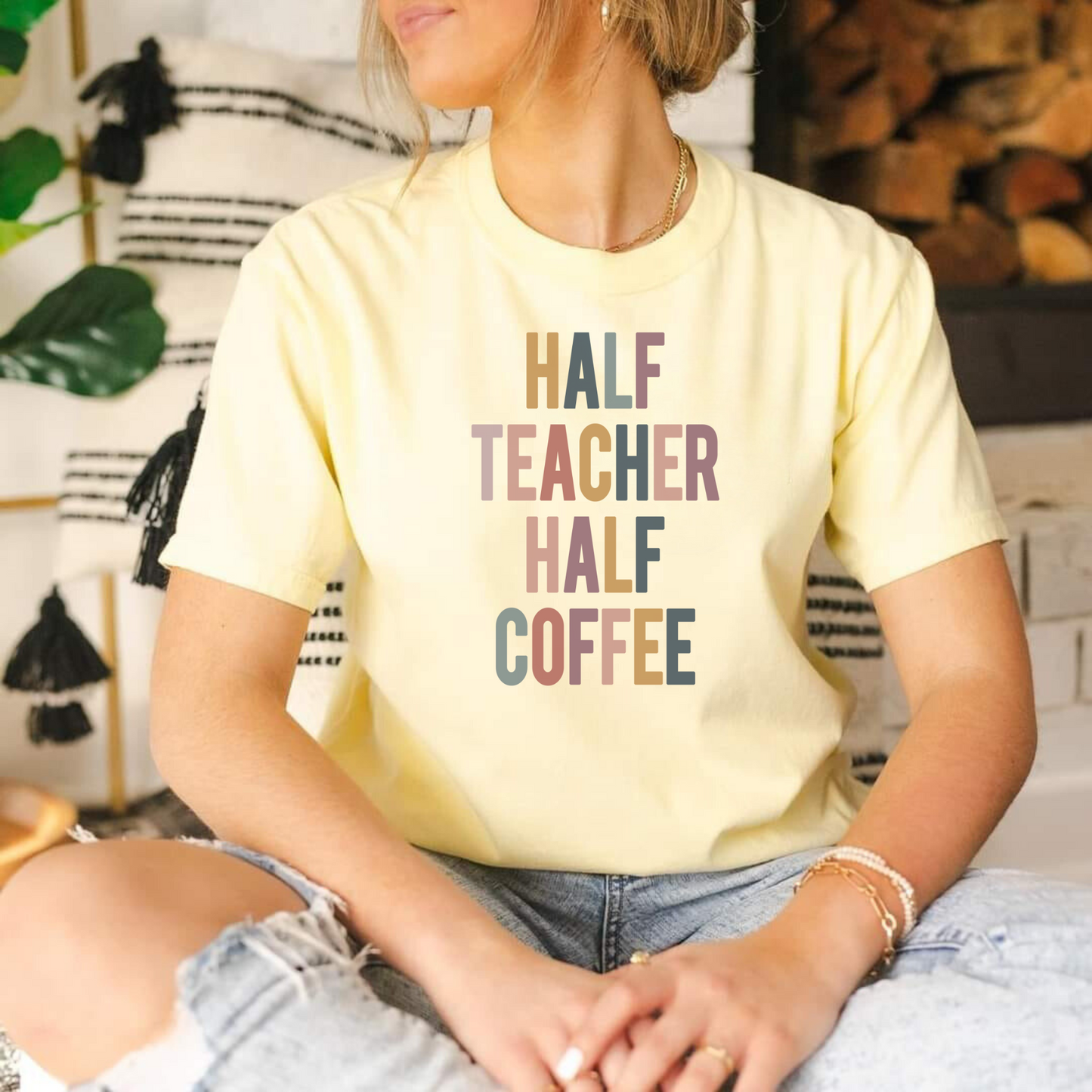 Humorous teacher shirt featuring the phrase 'Half Teacher Half Coffee'