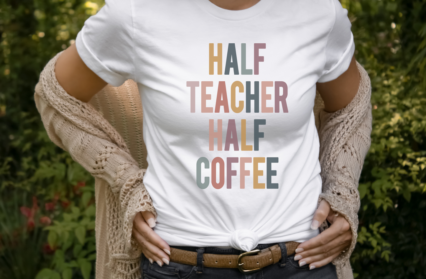Humorous teacher shirt featuring the phrase 'Half Teacher Half Coffee'