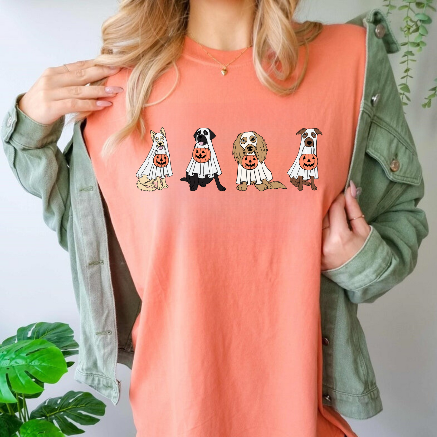 An oversized comfort colors shirt adorned with charming ghost dogs, capturing the essence of a cute and spooky Halloween. Ideal for dog lovers, this trendy shirt brings a touch of autumn to your wardrobe, making it a must-have for the fall season.