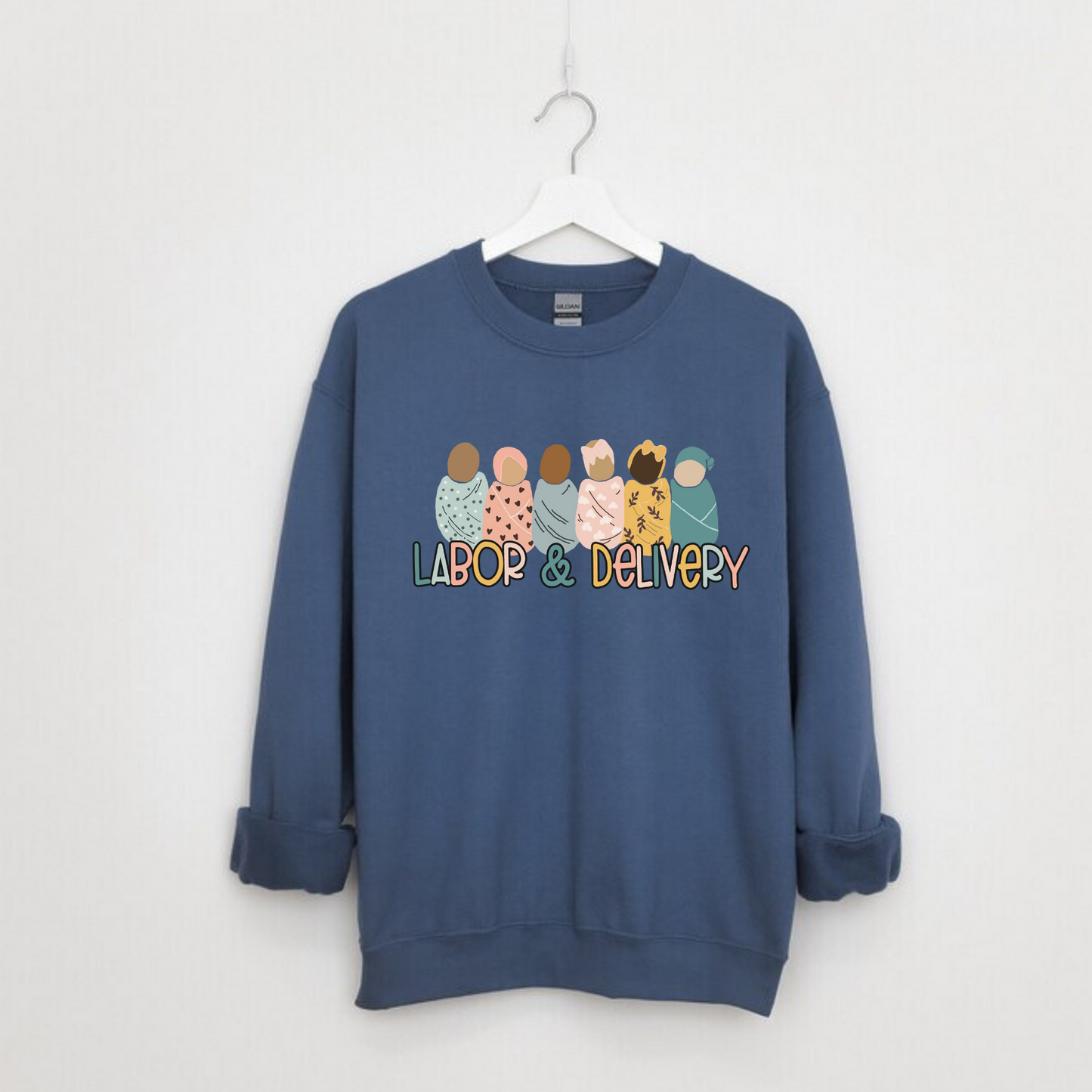 Make a statement with our Labor and Delivery Nurse Crewneck Sweatshirt. This cute nurse sweater is perfect for RNs and registered nurses working in labor and delivery (L&D). Elevate your nurse work outfit with this stylish and comfortable OB Nurse sweatshirt. Shop now and add this unique nurse sweatshirt to your collection of nurse clothes. Get ready to rock your nurse outfit for work as an L&D nurse!