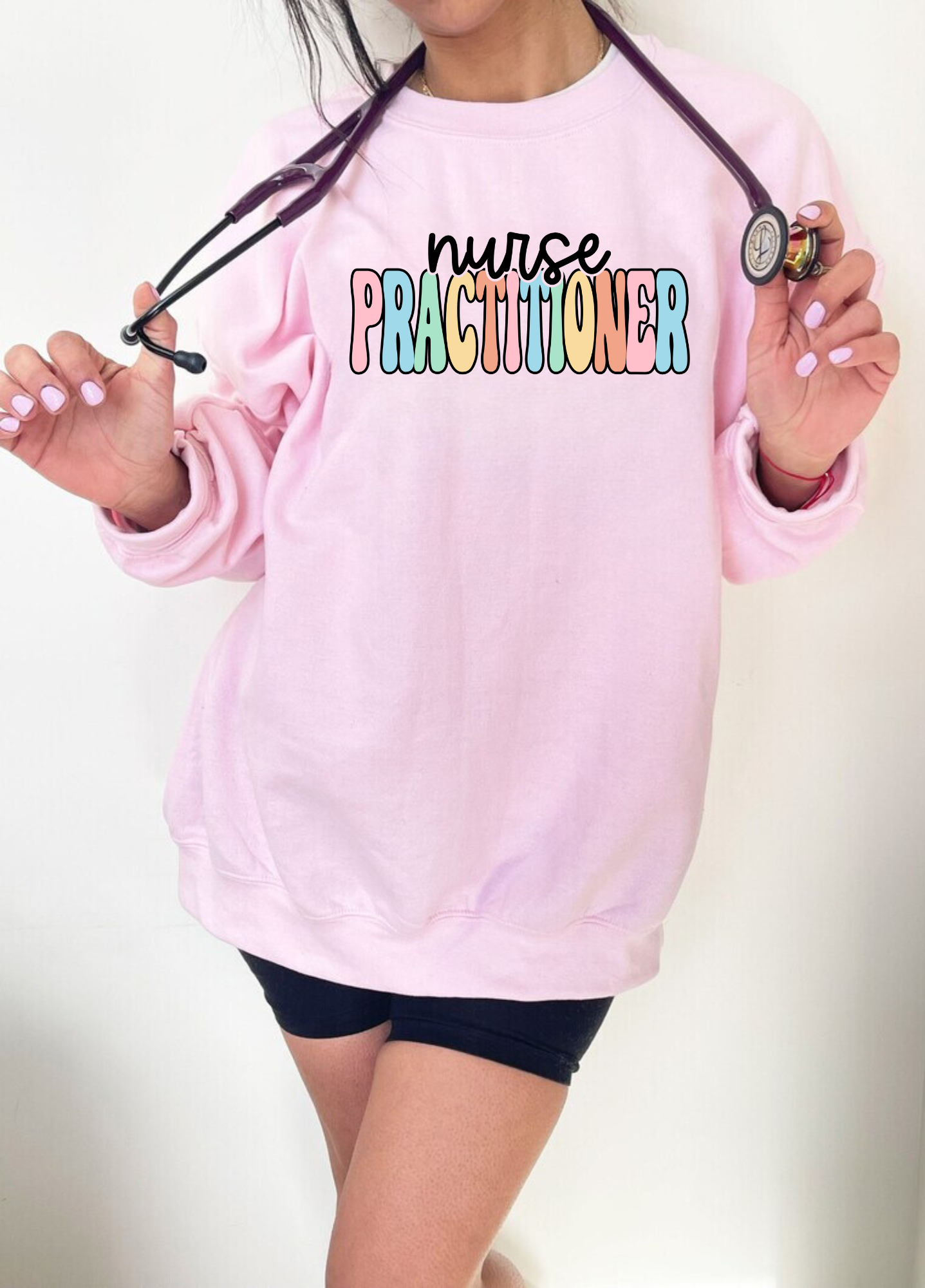 Nurse Practitioner crewneck sweatshirt for women, featuring a stylish design and comfortable fit. Perfect for nurse work outfits or casual wear.