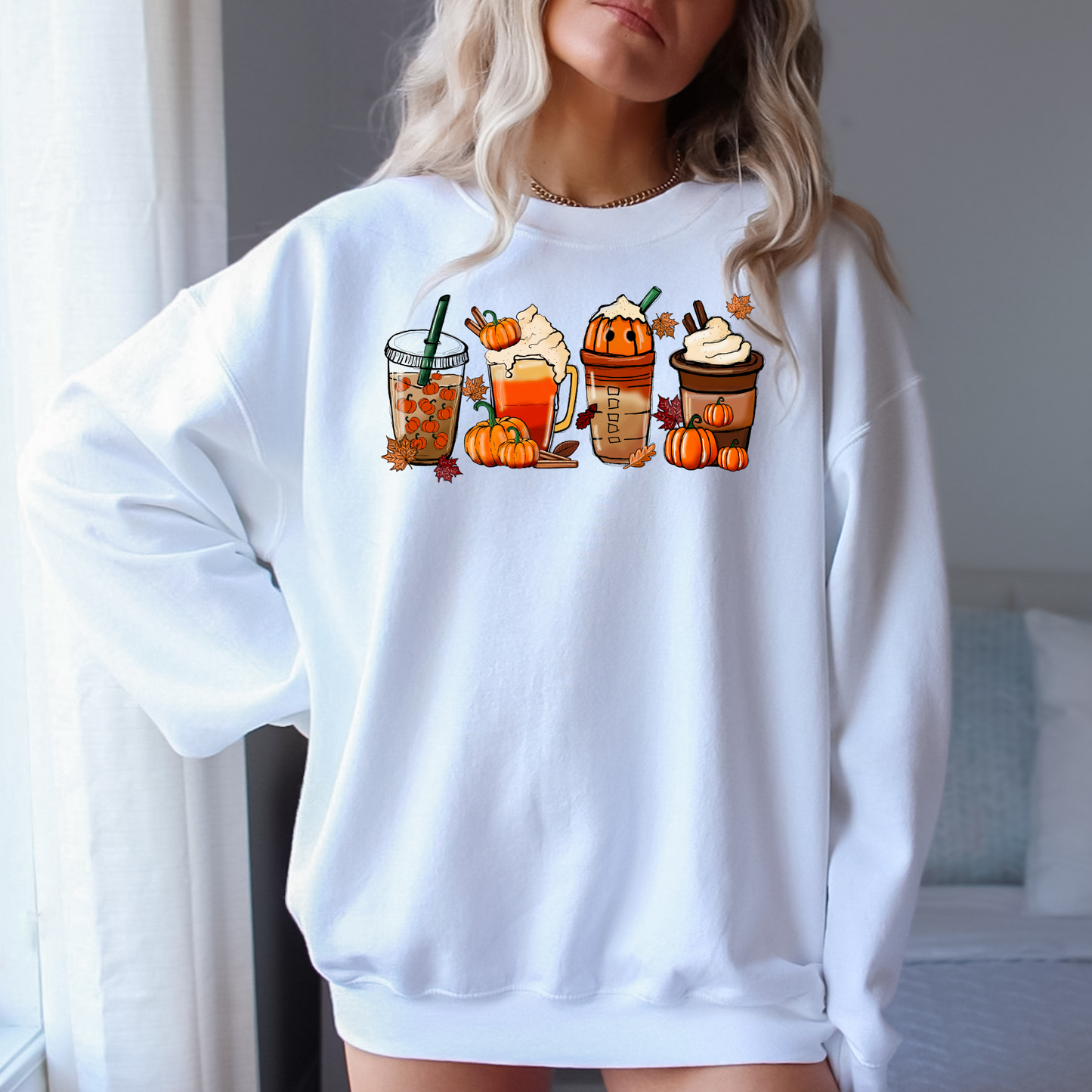 An oversized and trendy fall pumpkin coffee sweatshirt, perfect for a cute and comfortable fall outfit. The graphic sweatshirt features a pumpkin spice theme, ideal for coffee lovers and autumn enthusiasts.