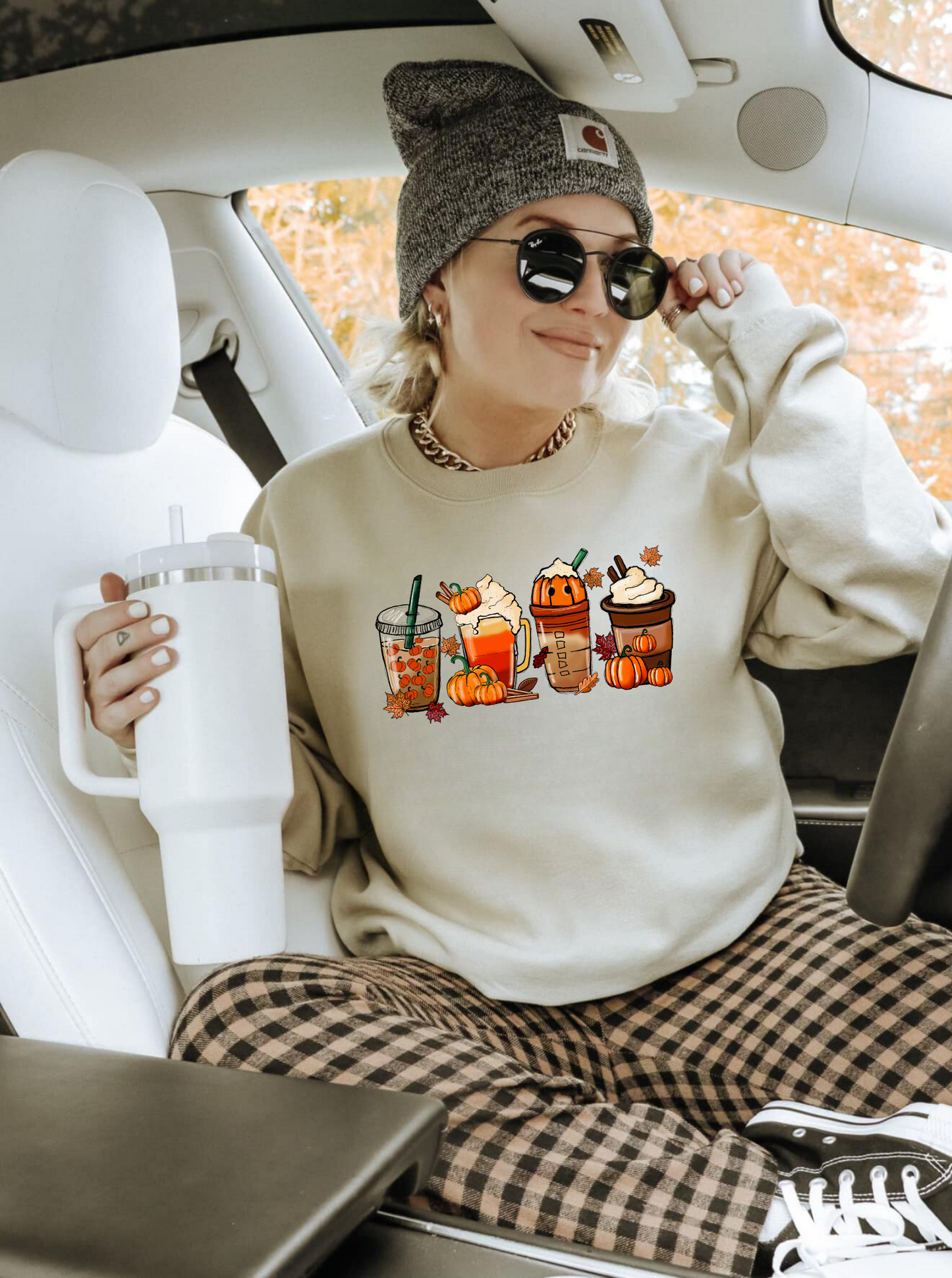 An oversized and trendy fall pumpkin coffee sweatshirt, perfect for a cute and comfortable fall outfit. The graphic sweatshirt features a pumpkin spice theme, ideal for coffee lovers and autumn enthusiasts.