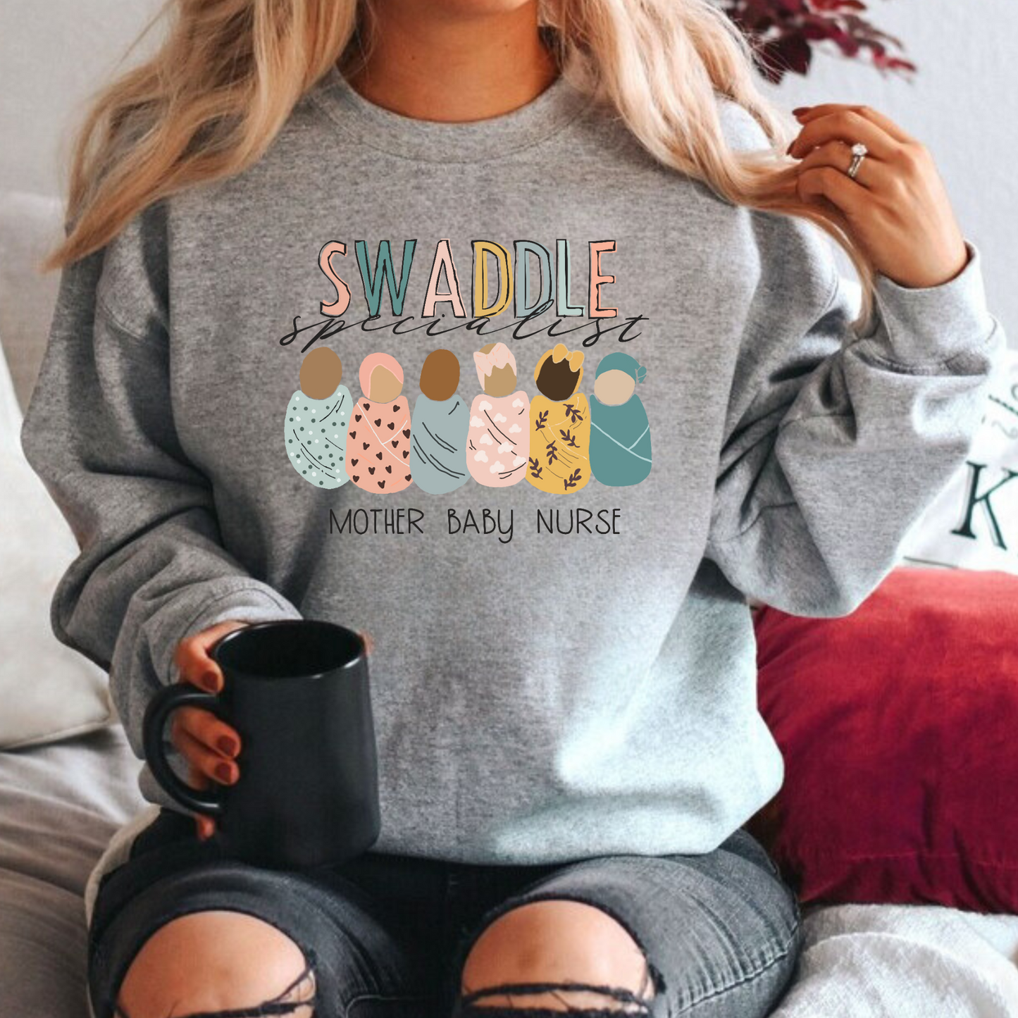 Elevate your nurse work outfit with our stylish Mother Baby Nurse Crewneck Sweatshirt. Designed for RNs and registered nurses specializing in postpartum care, this cute nurse sweater is a must-have. Stay cozy and comfortable while showcasing your dedication as an OB nurse. Shop now for the perfect nurse sweatshirt to complete your postpartum RN wardrobe and make a fashionable statement in your nurse clothes.