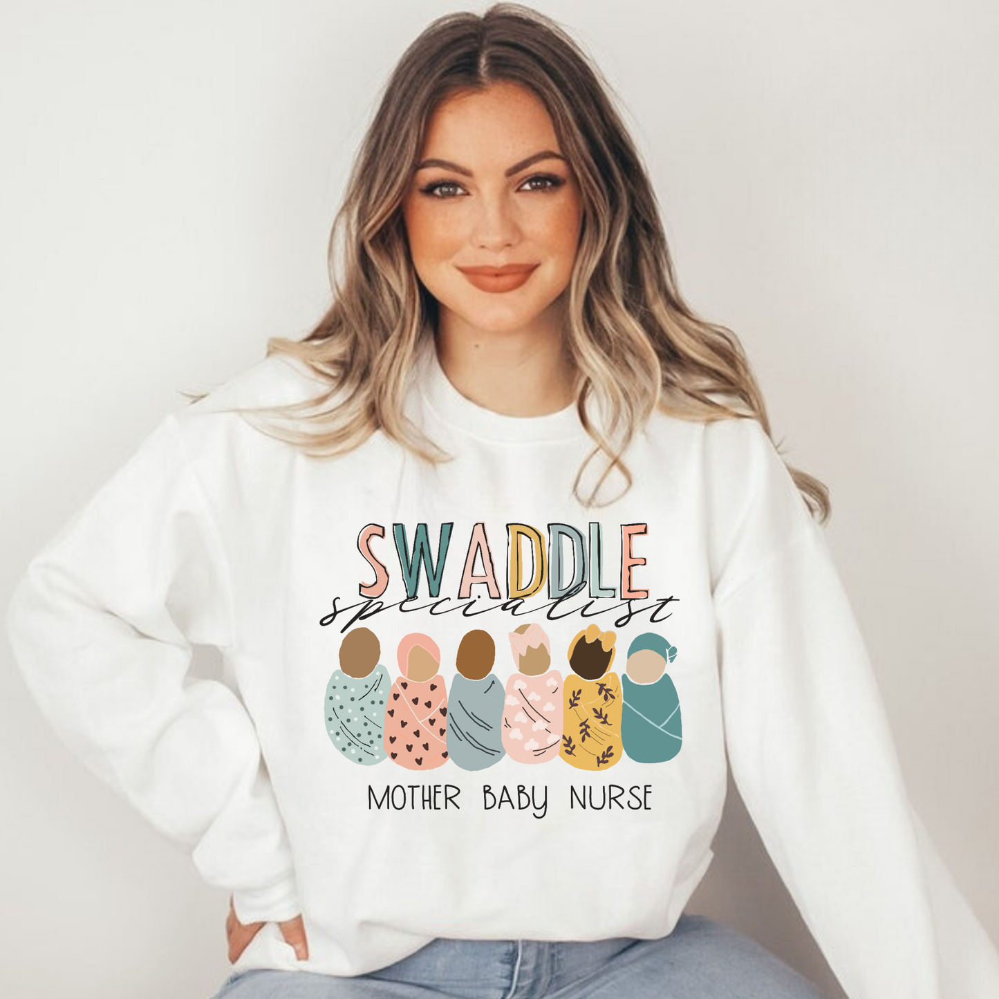 Elevate your nurse work outfit with our stylish Mother Baby Nurse Crewneck Sweatshirt. Designed for RNs and registered nurses specializing in postpartum care, this cute nurse sweater is a must-have. Stay cozy and comfortable while showcasing your dedication as an OB nurse. Shop now for the perfect nurse sweatshirt to complete your postpartum RN wardrobe and make a fashionable statement in your nurse clothes.