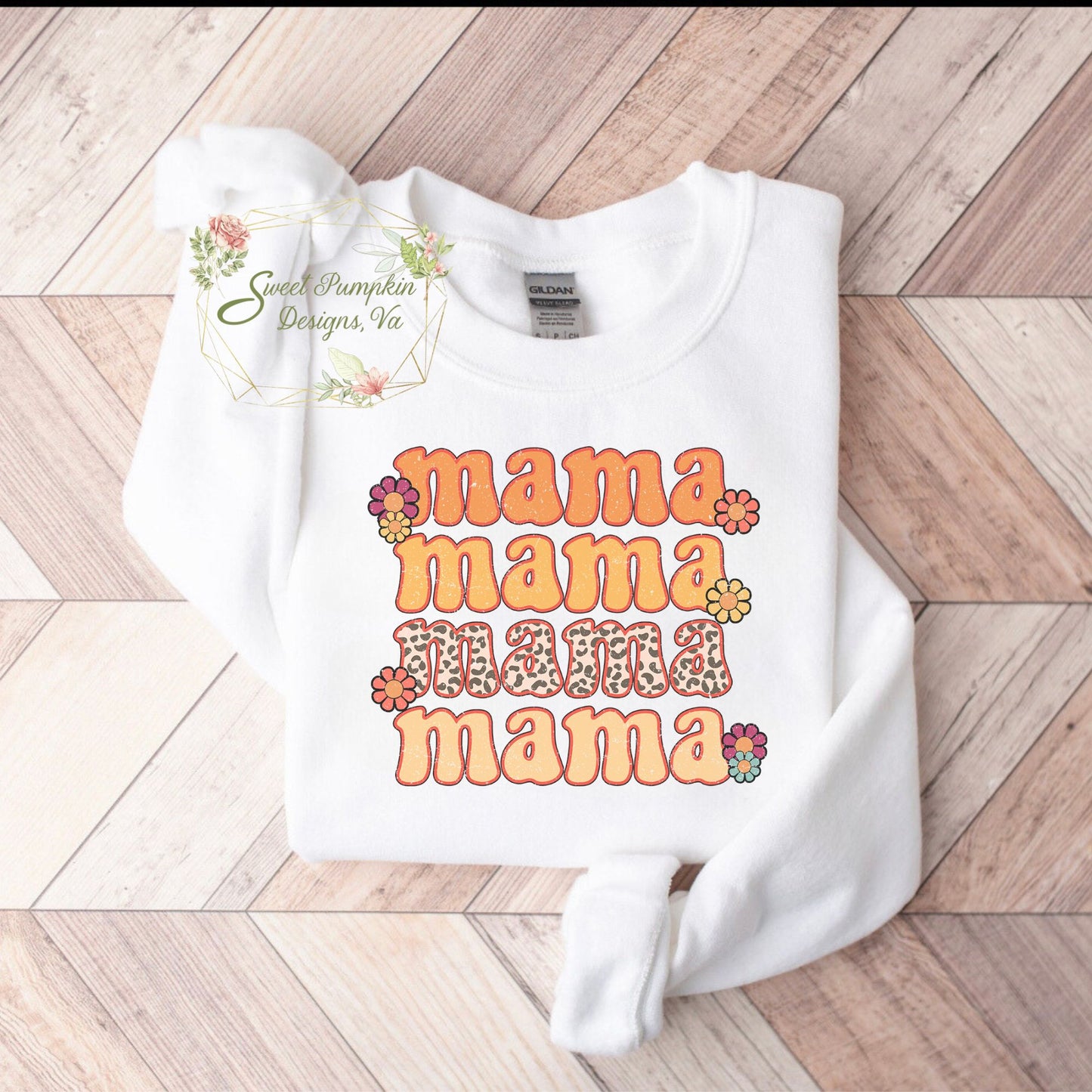 A cozy sweatshirt in a muted mustard color with a retro daisy design on the front. The crewneck sweatshirt features ribbed cuffs and hem, and long sleeves.