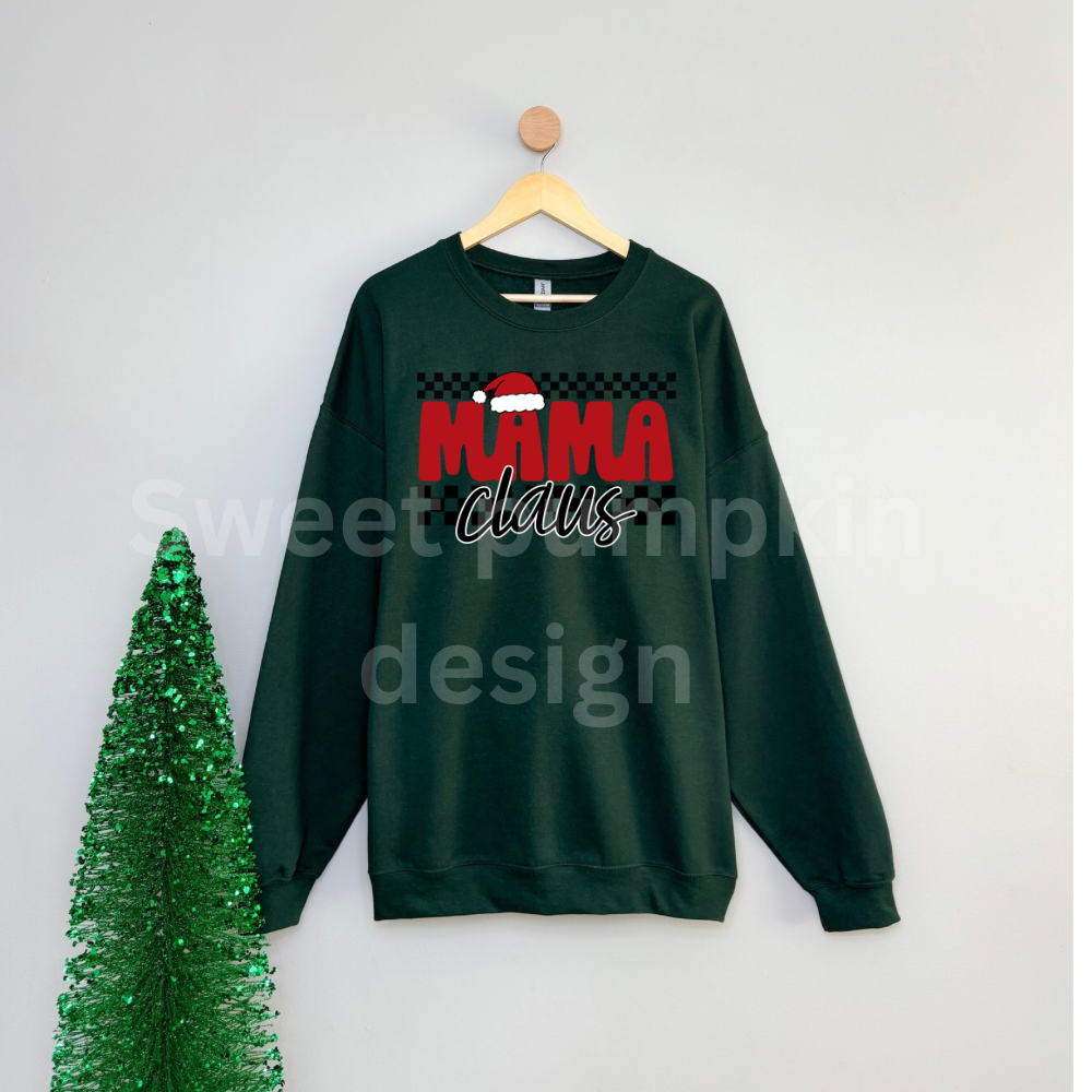 Green sweatshirt with 'Mama Claus' text on a hanger against a white background