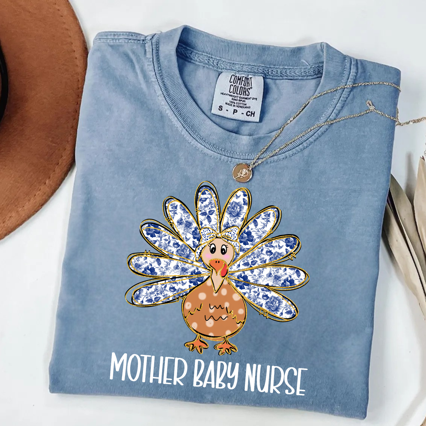 Comfort Colors Thanksgiving Mother Baby Nurse Shirt featuring cute turkey design, perfect for L&D, NICU, and postpartum nurses.
