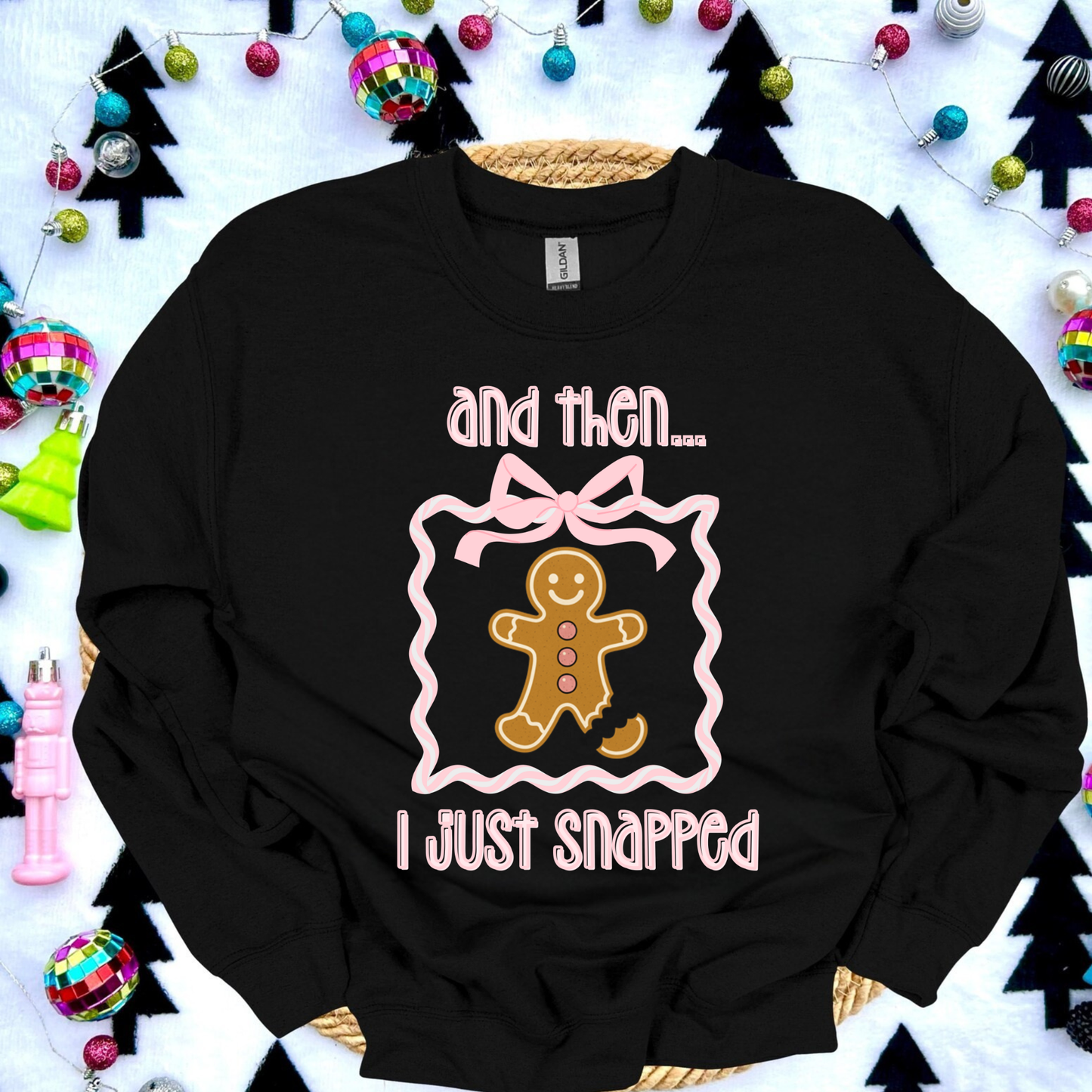 Funny gingerbread Christmas sweatshirt with “and then I just snapped” quote and broken-leg gingerbread graphic, on Gildan 18000 crewneck.