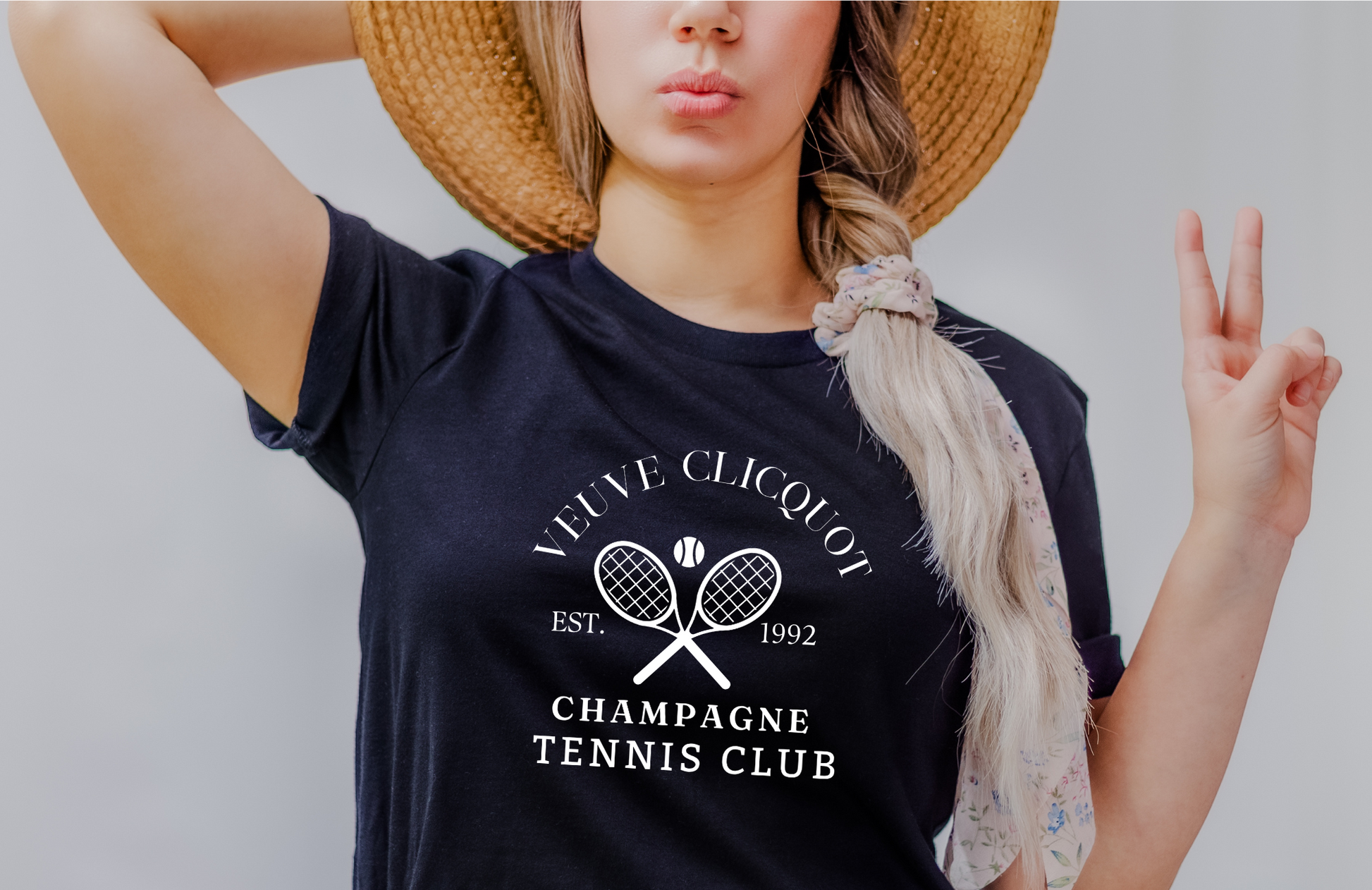 A champagne tennis shirt with a classic and preppy design, perfect for a sophisticated summer outfit.