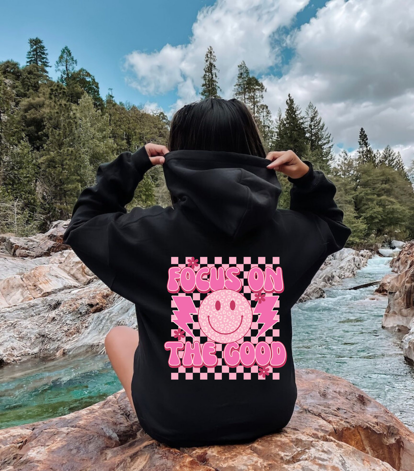 Oversized preppy hoodie with a smiley face design on the back that says 'Focus on the good'. The hoodie exudes a trendy y2k aesthetic, perfect for those seeking comfortable and stylish preppy clothing.