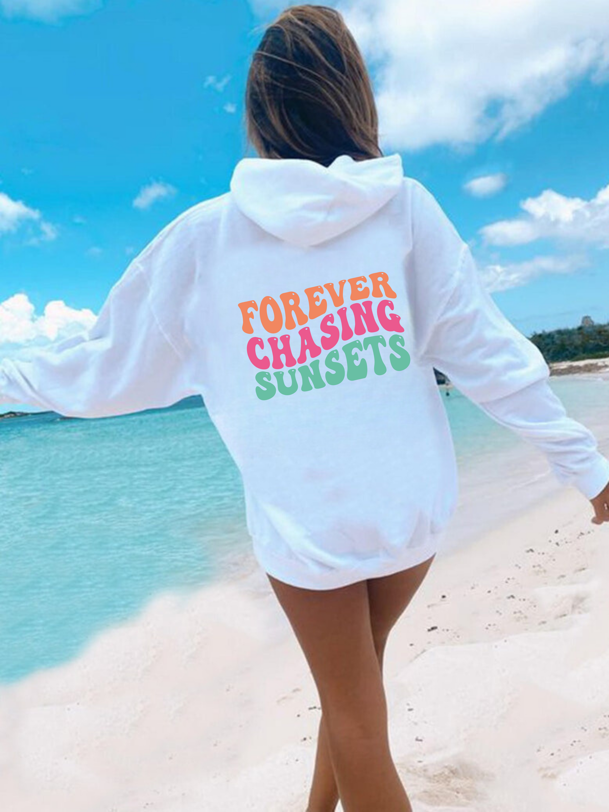 "Forever Chasing Sunsets" oversized beach hoodie sweatshirt for women, featuring a graphic print and relaxed fit. Perfect for beach outings and summer vibes.