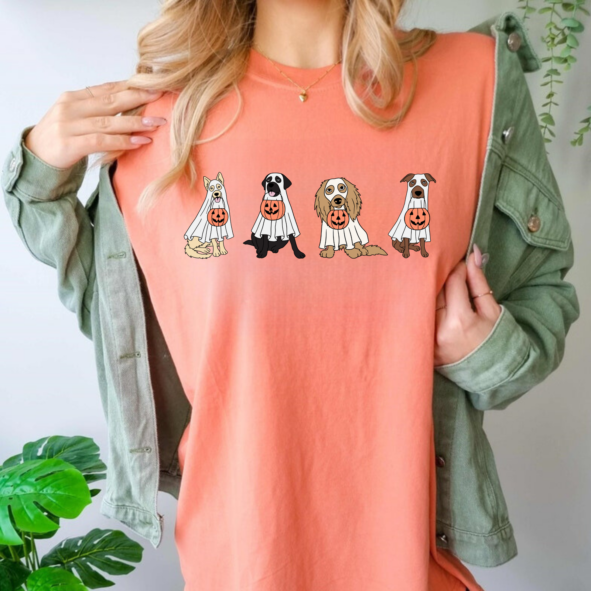 An oversized comfort colors shirt adorned with charming ghost dogs, capturing the essence of a cute and spooky Halloween. Ideal for dog lovers, this trendy shirt brings a touch of autumn to your wardrobe, making it a must-have for the fall season.