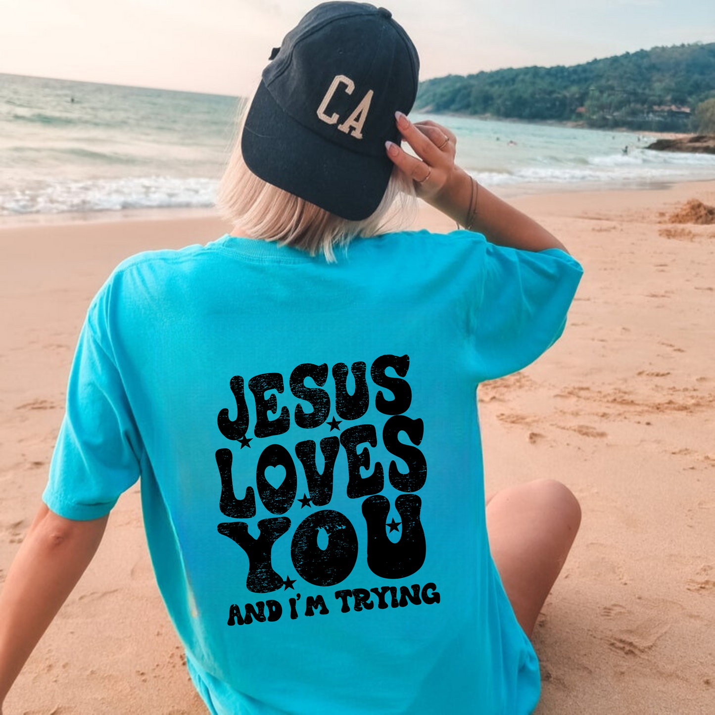 Trendy oversized Comfort Colors t-shirt with "Jesus Loves You and I'm Trying" message on the back. Perfect for a comfy and stylish outfit.