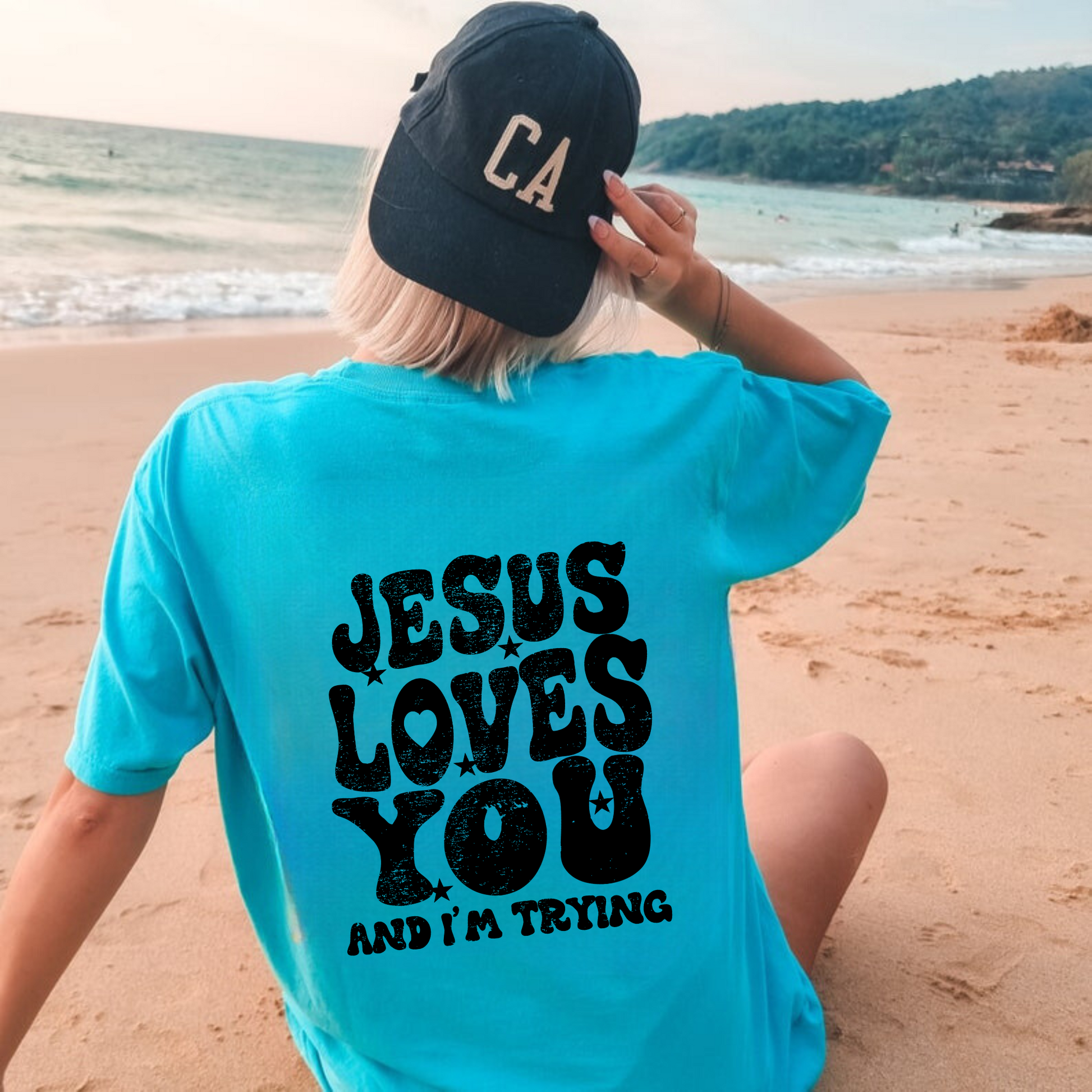 Trendy oversized Comfort Colors t-shirt with "Jesus Loves You and I'm Trying" message on the back. Perfect for a comfy and stylish outfit.