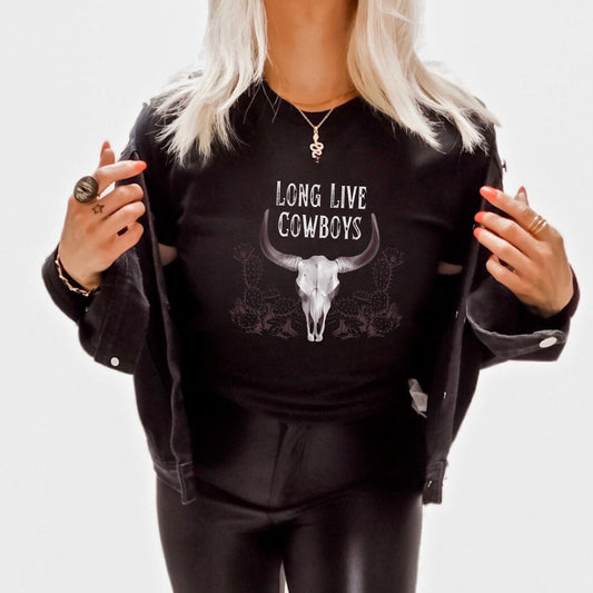 "Long Live Cowboys" vintage western t-shirt with a rustic cow skull and cacti design. Perfect for rodeo and Wild West enthusiasts. Made from high-quality material, this shirt is both comfortable and durable for everyday wear or special occasions.