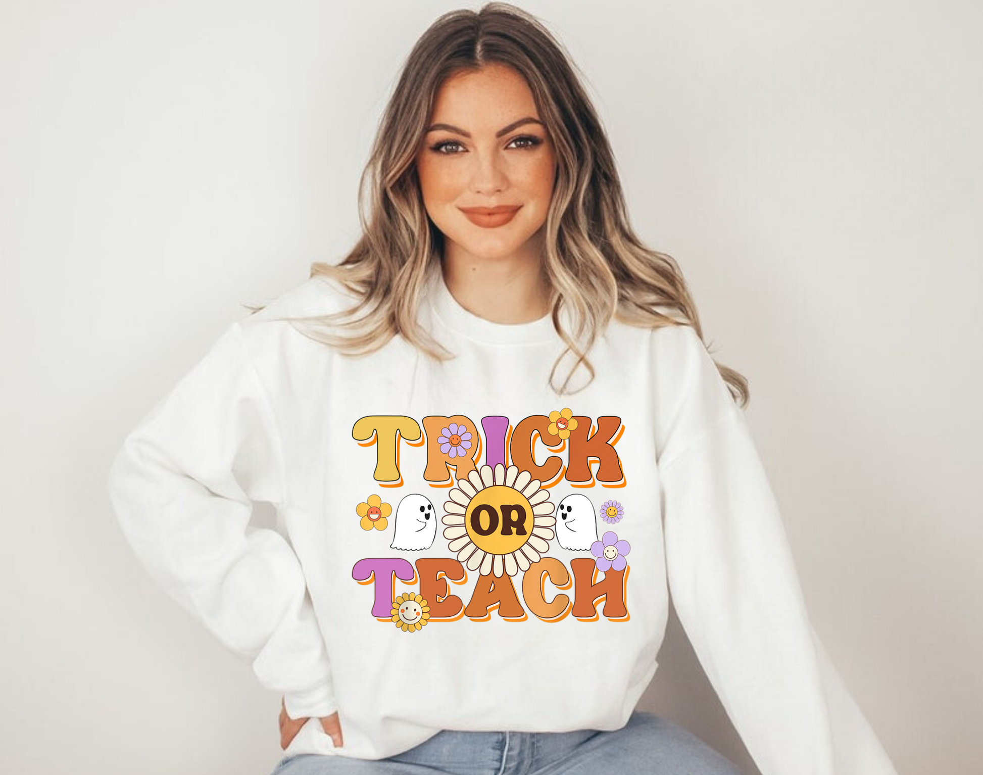 "Trick or Teach" Halloween teacher sweatshirt with a fun Halloween-themed design.
