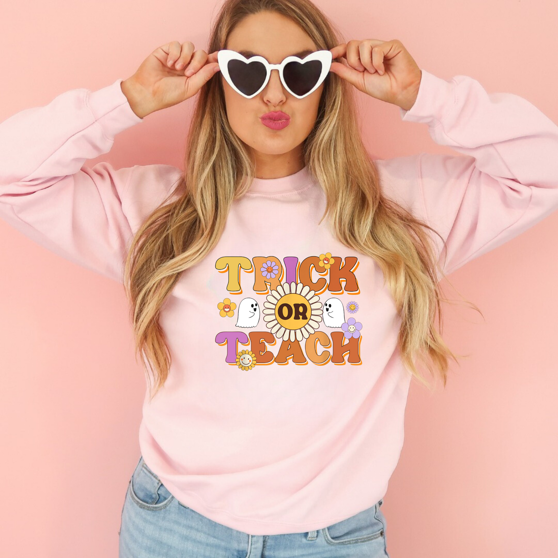 "Trick or Teach" Halloween teacher sweatshirt with a fun Halloween-themed design.